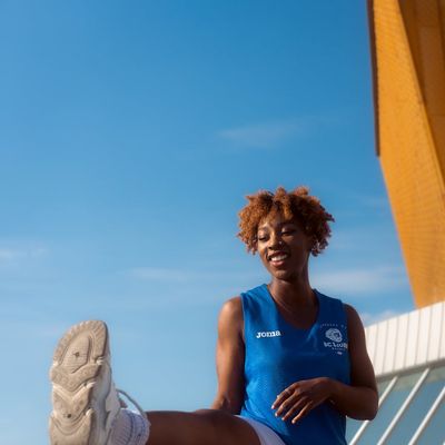 Portrait of a smiling confident woman in athletic wear.